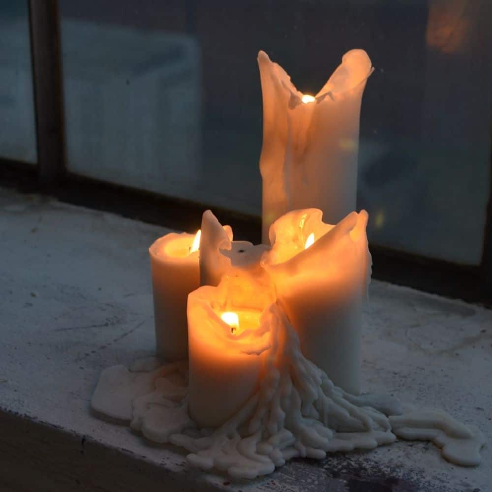 photo of candles on a windowsill
