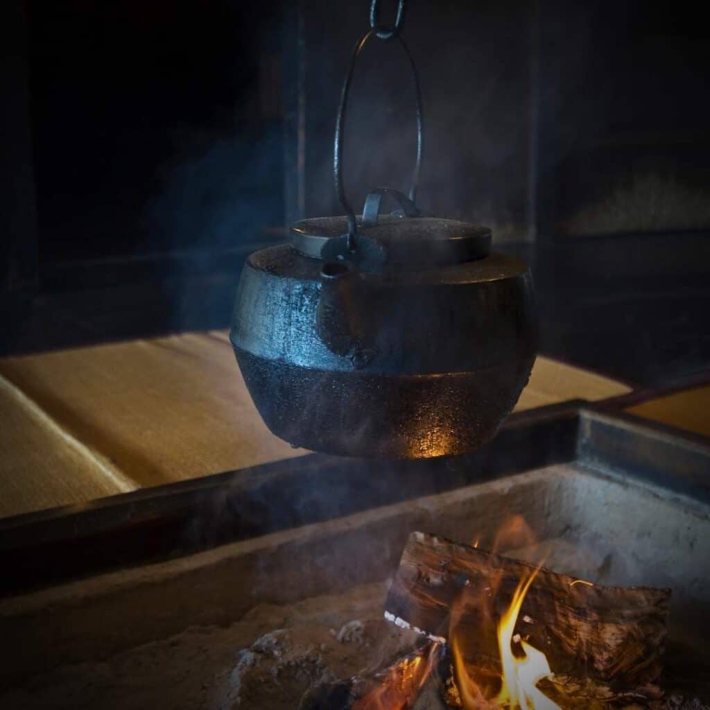 photo of a cast iron kettle and hearth