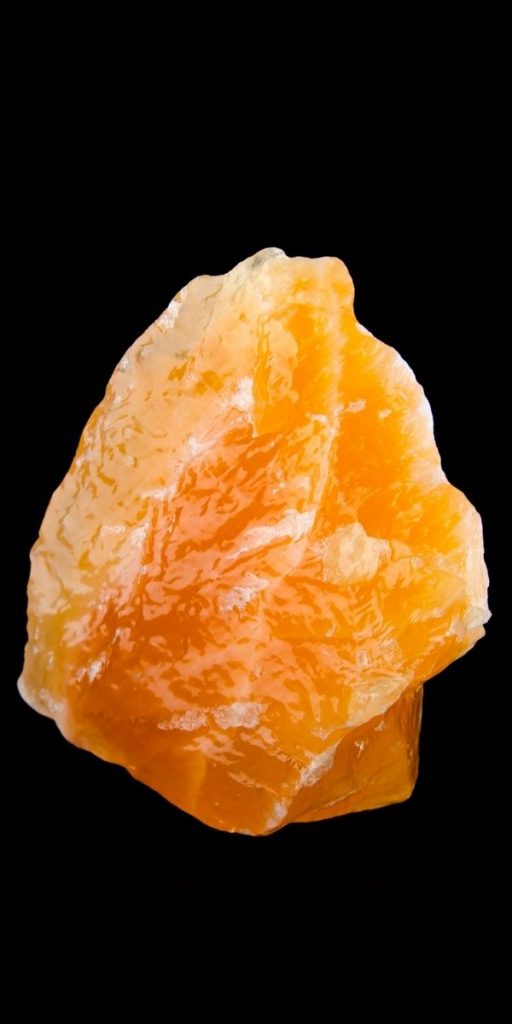 Photo of Orange Calcite as a part of crystals for confidence guide